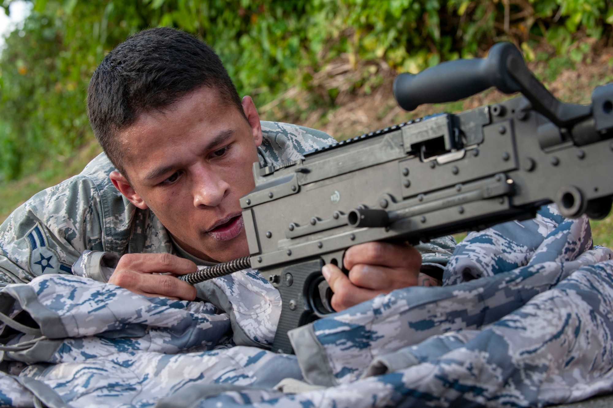 U.S. Air Force Airman 1st Class Samuel Gonzales, 18th Security Forces Squadron armorer, assembles an M240 machine gun during the Defenders Challenge Feb. 13, 2020, at Kadena Air Base, Japan. This Defenders Challenge tested basic combat skills and competitor knowledge at various stations along the course. (U.S. Air Force photo by Naoto Anazawa)