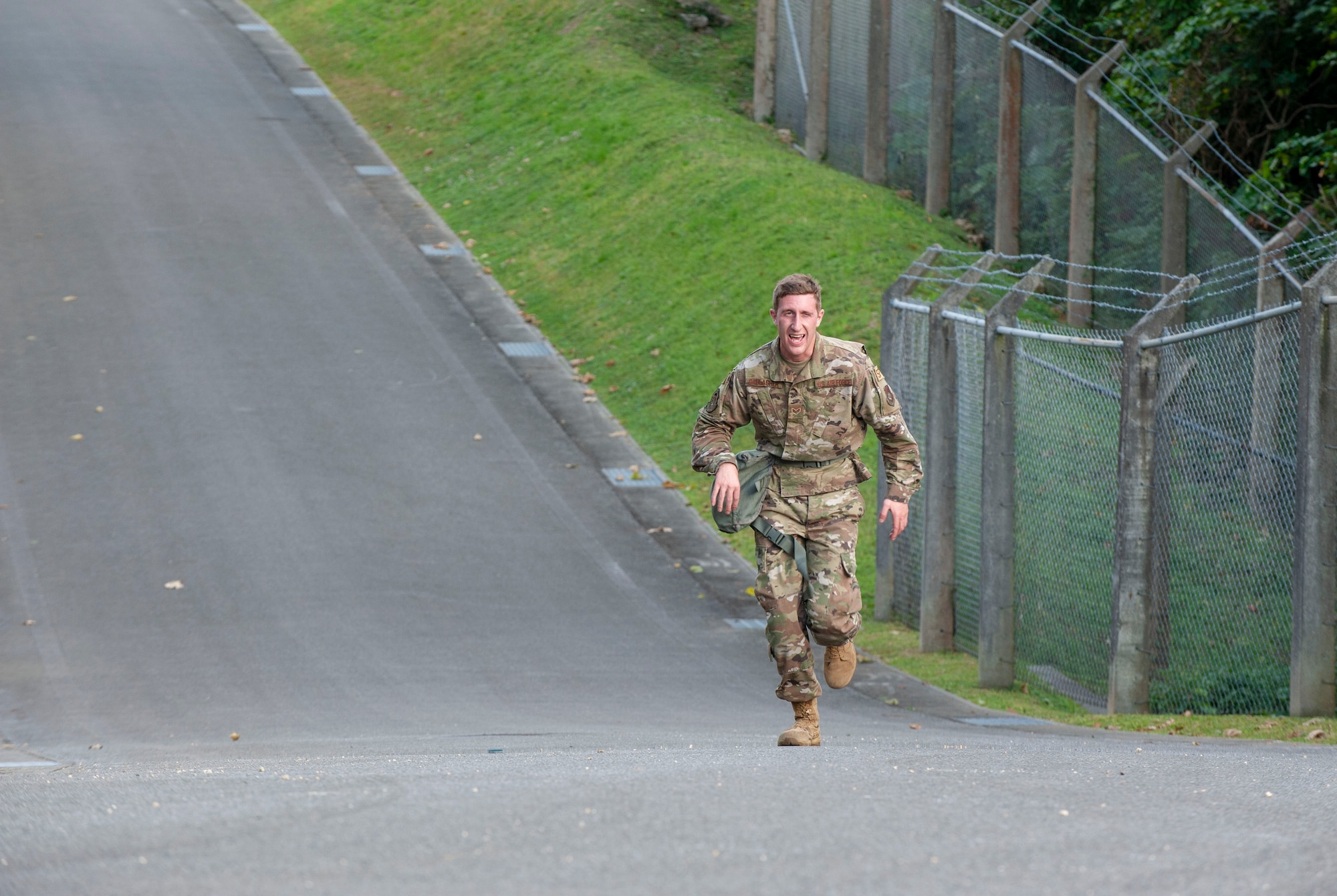 U.S. Air Force Senior Airman Colton Gallagher, 18th Security Forces Squadron response force leader, runs the Habu Trail during the Defenders Challenge Feb. 13, 2020, at Kadena Air Base, Japan. The Defenders Challenge helps develop tactics, techniques, and procedures ensuring capable security forces Airmen. (U.S. Air Force photo by Naoto Anazawa)