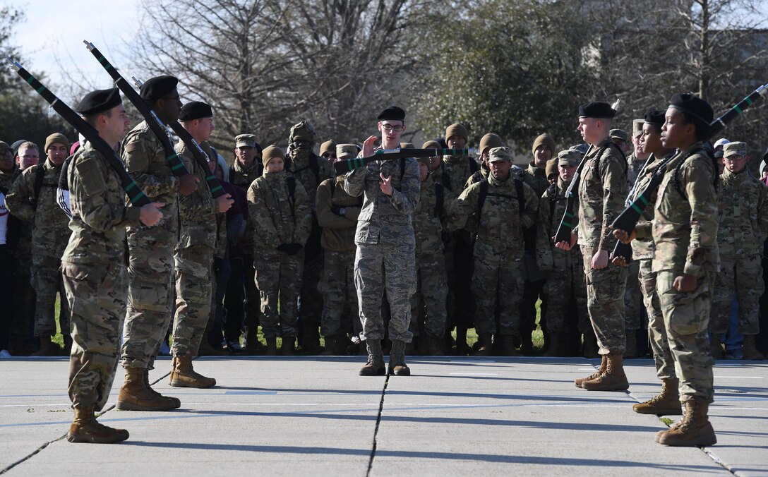 Members of the 334th Training Squadron freestyle drill team perform during the 81st Training Group drill down on the Levitow Training Support Facility drill pad at Keesler Air Force Base, Mississippi, Feb. 21, 2020. Airmen from the 81st TRG competed in a quarterly open ranks inspection, regulation drill routine and freestyle drill routine. Keesler trains more than 30,000 students each year. While in training, Airmen are given the opportunity to volunteer to learn and execute drill down routines. (U.S. Air Force photo by Kemberly Groue)