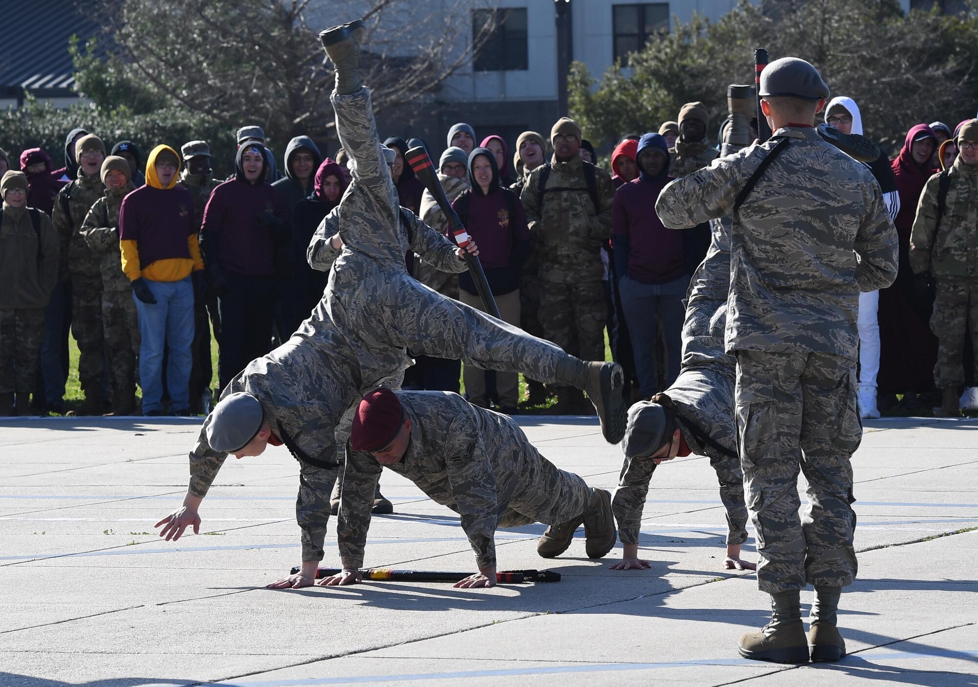 Members of the 335th Training Squadron freestyle drill team perform during the 81st Training Group drill down on the Levitow Training Support Facility drill pad at Keesler Air Force Base, Mississippi, Feb. 21, 2020. Airmen from the 81st TRG competed in a quarterly open ranks inspection, regulation drill routine and freestyle drill routine. Keesler trains more than 30,000 students each year. While in training, Airmen are given the opportunity to volunteer to learn and execute drill down routines. (U.S. Air Force photo by Kemberly Groue)