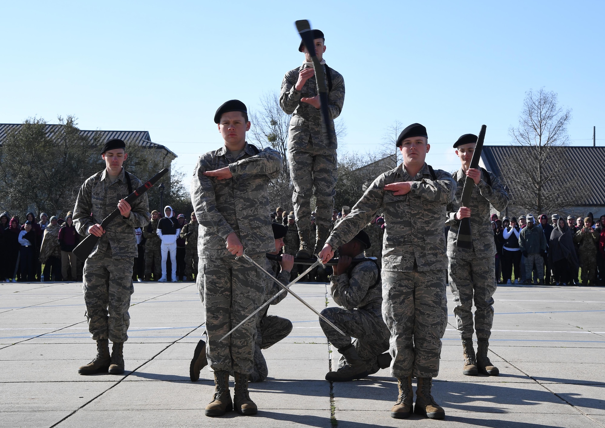 Members of the 338th Training Squadron freestyle drill team perform during the 81st Training Group drill down on the Levitow Training Support Facility drill pad at Keesler Air Force Base, Mississippi, Feb. 21, 2020. Airmen from the 81st TRG competed in a quarterly open ranks inspection, regulation drill routine and freestyle drill routine. Keesler trains more than 30,000 students each year. While in training, Airmen are given the opportunity to volunteer to learn and execute drill down routines. (U.S. Air Force photo by Kemberly Groue)