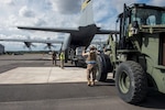 Airmen from the 621st Contingency Response Wing unload cargo from a C-130 Hercules that will be used for simulated humanitarian and disaster relief assistance during Exercise Turbo Distribution at Fort Stewart-Hunter Army Airfield, Georgia, Feb. 10, 2020. Members of the 621st CRW have partnered with the U.S. Army 689th Rapid Port Opening Element and Defense Logistics Agency Rapid Deployment Team to become a Joint Task Force-Port Opening unit capable of deploying to provide mobility options and facilitating humanitarian and disaster relief assistance. (U.S. Air Force photo by Staff Sgt. Sarah Brice)