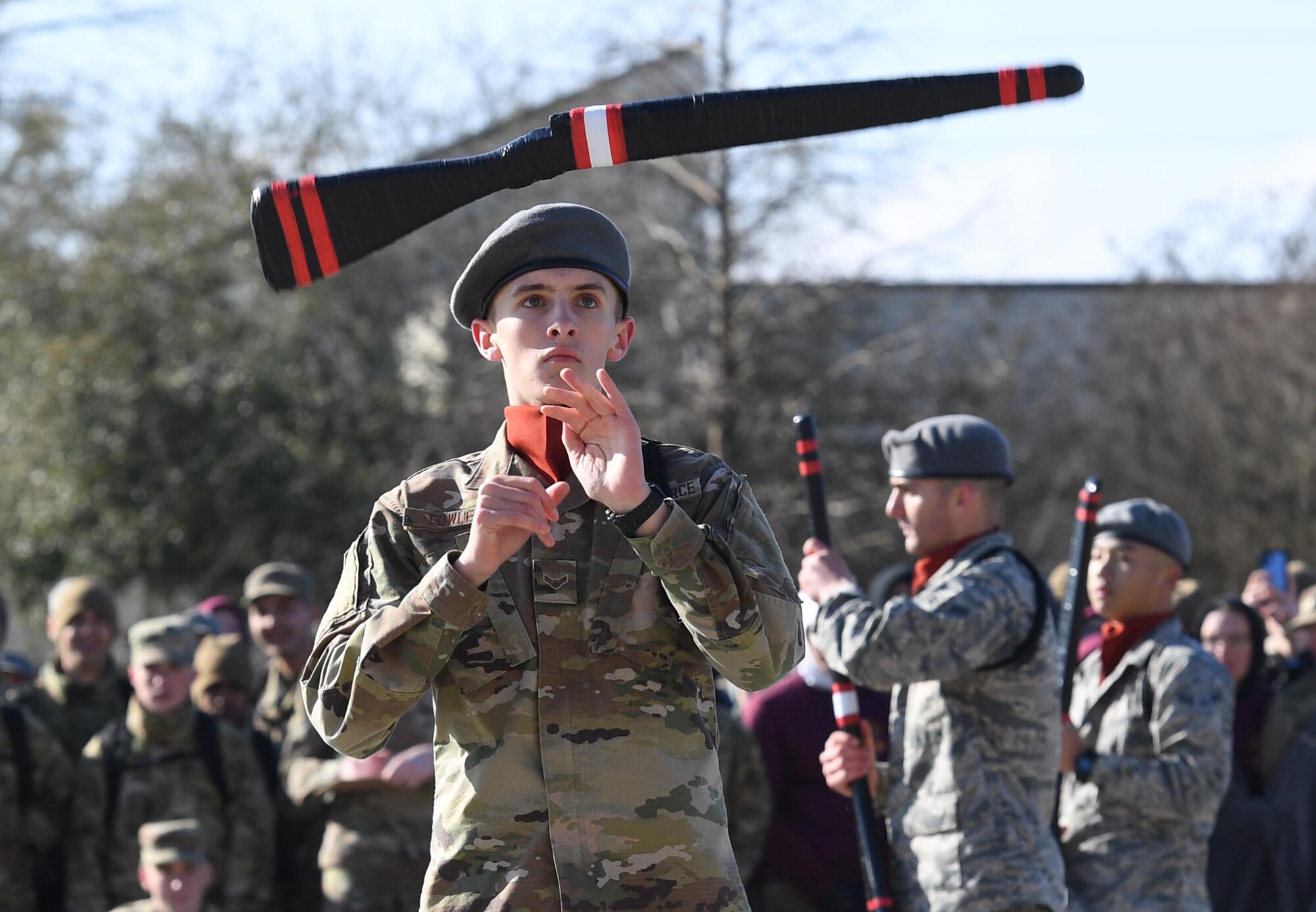 U.S. Air Force Airman 1st Class Ethan Fowler, 335th Training Squadron freestyle drill team member, spins a rifle during the 81st Training Group drill down on the Levitow Training Support Facility drill pad at Keesler Air Force Base, Mississippi, Feb. 21, 2020. Airmen from the 81st TRG competed in a quarterly open ranks inspection, regulation drill routine and freestyle drill routine. Keesler trains more than 30,000 students each year. While in training, Airmen are given the opportunity to volunteer to learn and execute drill down routines. (U.S. Air Force photo by Kemberly Groue)