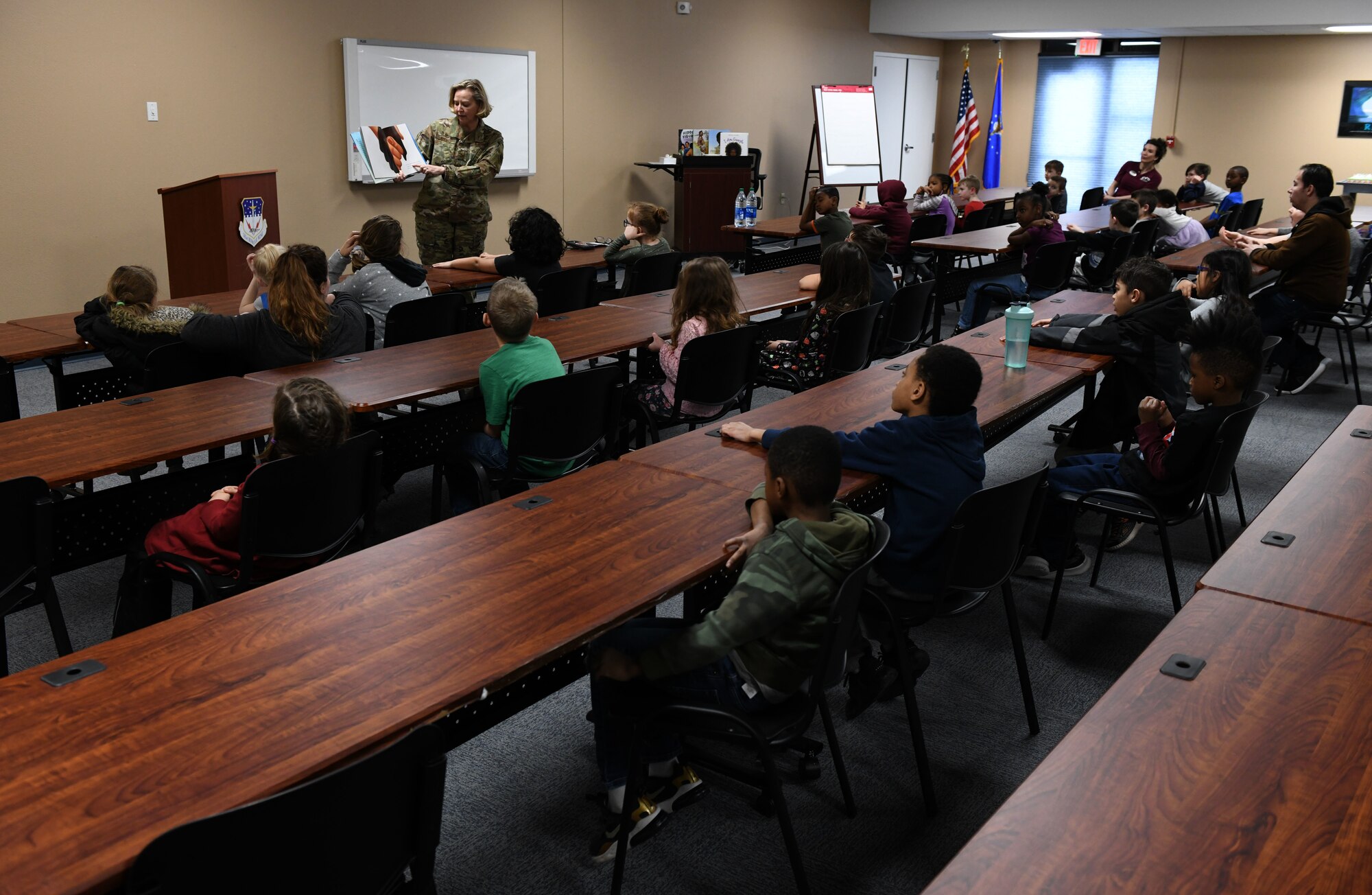 Col. Jennifer Reeves, 341st Missile Wing commander, reads to children at the Youth Center Feb. 12, 2020, at Malmstrom Air Force Base, Mont.