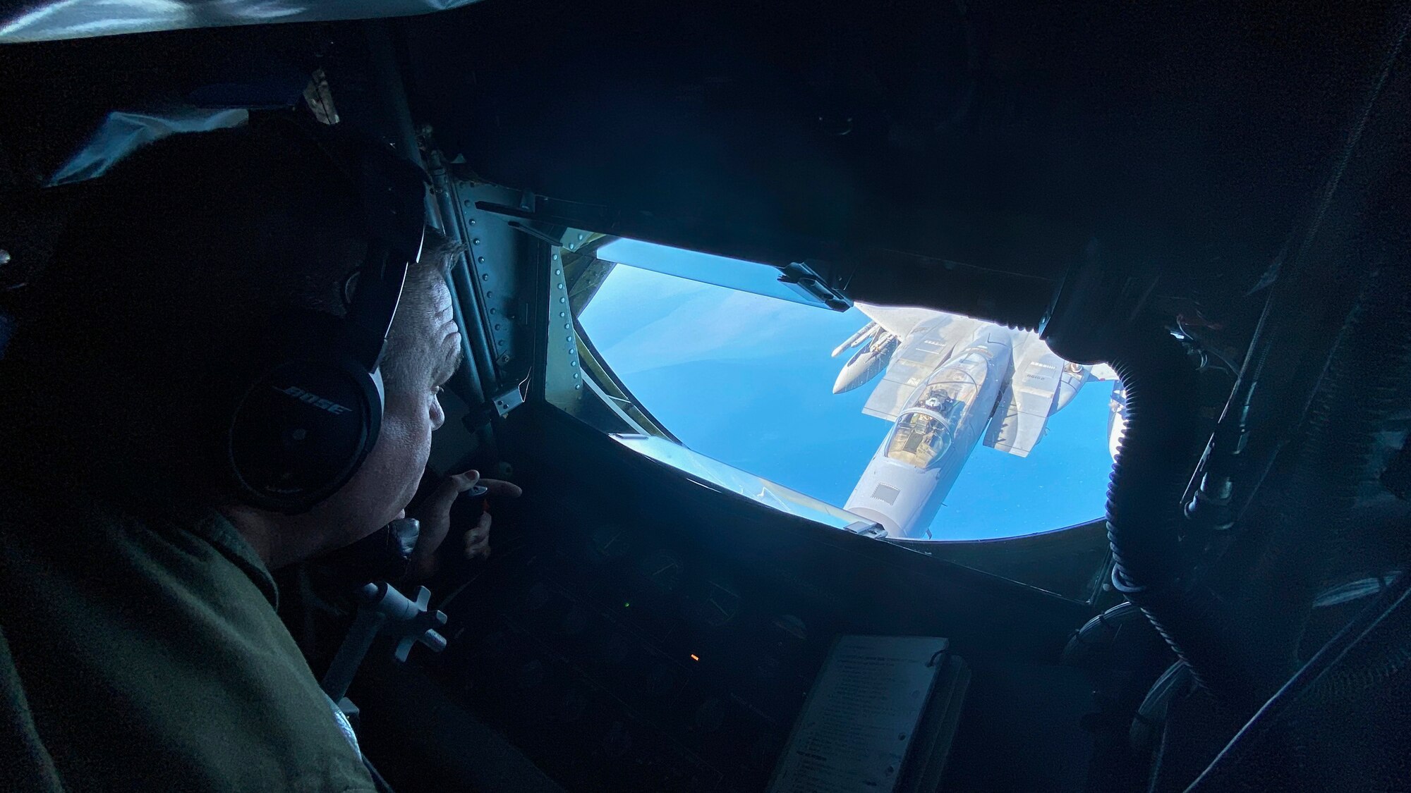 U.S. Air Force Tech. Sgt. Jordan Jungwirth IV, a KC-135 Stratotanker boom operator assigned to the 128th Air Refueling Wing at General Mitchell Air National Guard Base, Wisconsin, controlled the boom during an air refueling mission over the Gulf of Mexico. The KC-135 Stratotanker can hold about 200,000 pounds of fuel.