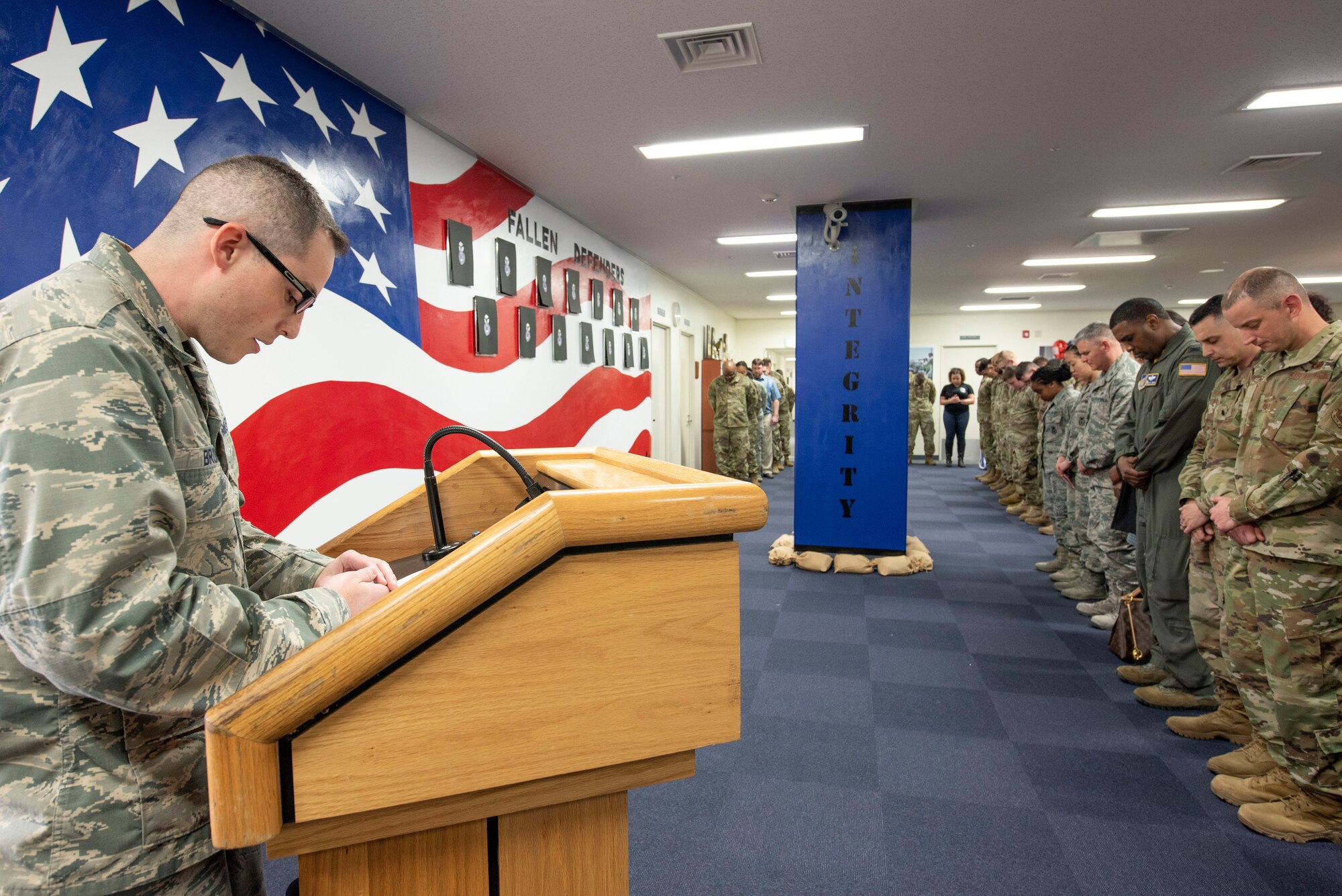 Capt. Lance Brown, 374th Wing Staff Agency chaplain, gives the invocation at a mural unveiling ceremony at Yokota Air Base, Japan, Feb. 21, 2020.