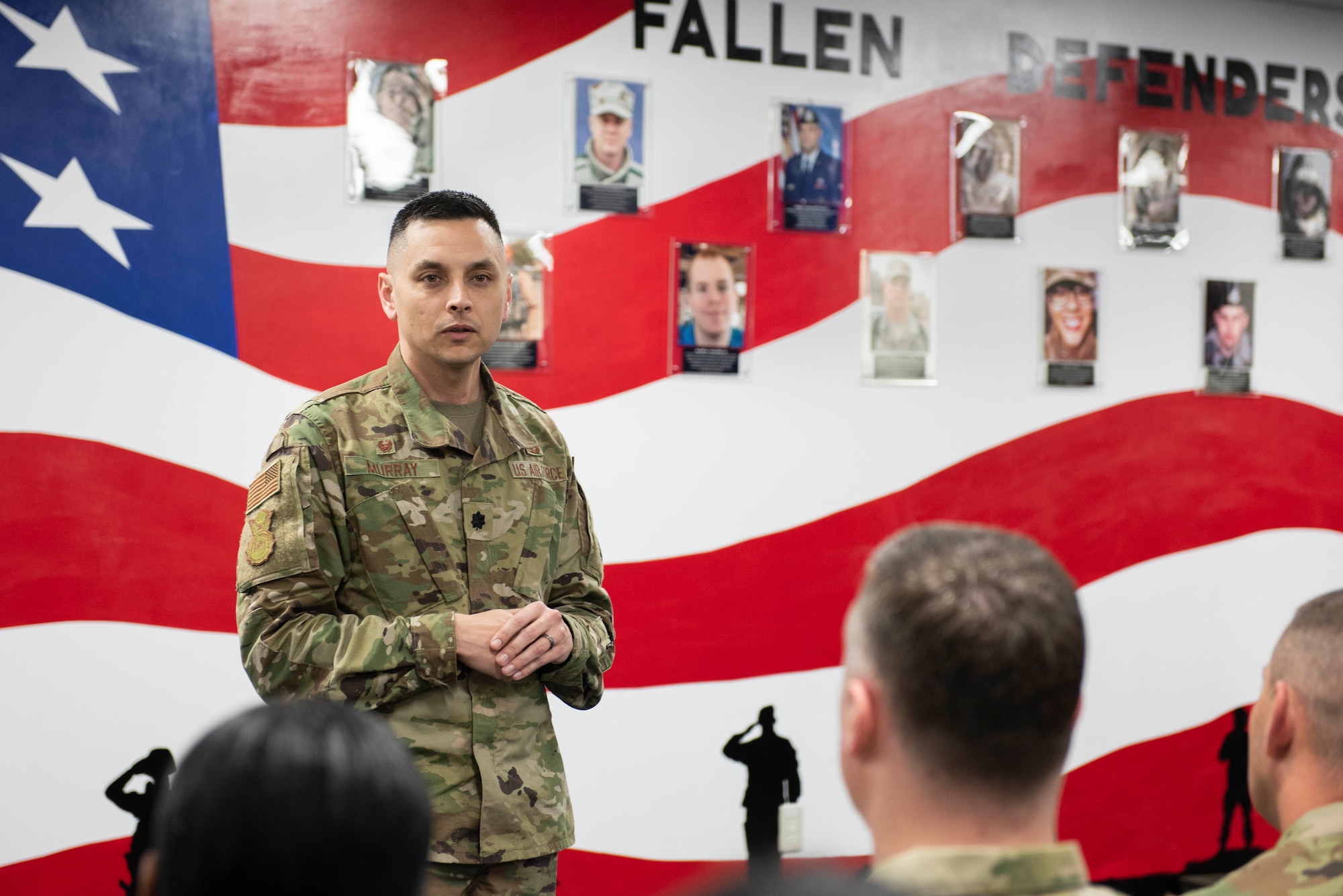 Lt. Col. Jonathan Murray, 374th Security Forces Squadron commander, gives a speech during a mural unveiling ceremony at Yokota Air Base, Japan, Feb. 21, 2020.