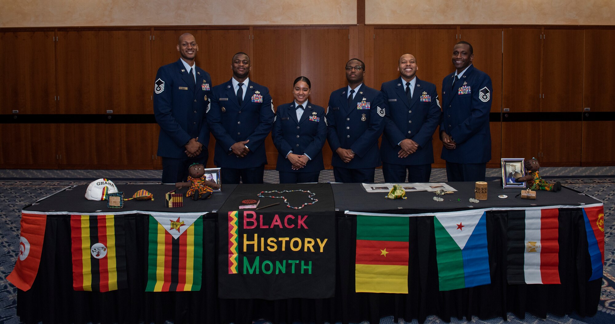 Members of the 52nd Fighter Wing African American Heritage Committee pose for a photo at the annual Black History Month Luncheon at Spangdahlem Air Base, Germany, Feb. 24, 2020. The committee organized a display of authentic cultural artifacts from various African heritages during the luncheon. (U.S. Air Force photo by Airman 1st Class Alison Stewart)