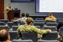 U.S. Marine Gunnery Sgt. Juan Morales, assigned to Joint Task Force Civil Support’s operations directorate, gives a convoy brief in preparation for a routine vehicle roll out.