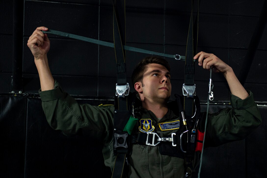 Photo of an emergency parachute training student practicing emergency parachute procedures.