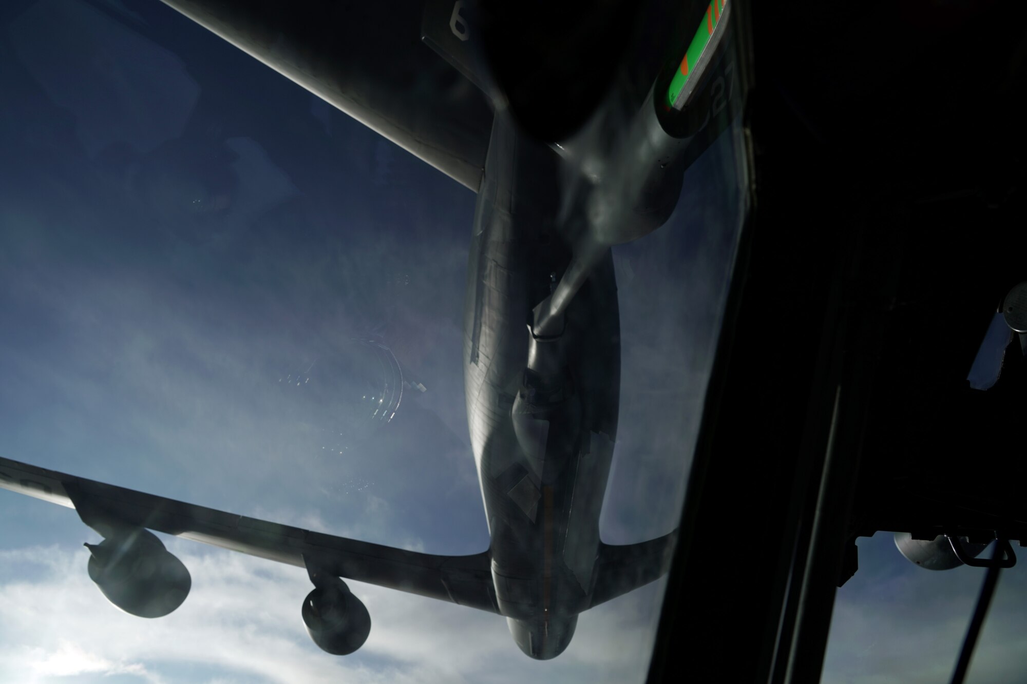 A KC-135 conducts air refueling with a E-3G Sentry.
