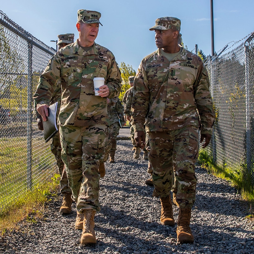 Lt. Gen. Stephen G. Fogarty, commanding general of U.S. Army Cyber Command (left), and Lt. Gen. Bruce T. Crawford, U.S. Army Chief Information Officer/G6, visit tactical operations centers at Joint Warfighting Assessment 19, on Joint Base Lewis-McChord, Wash., May 1, 2019