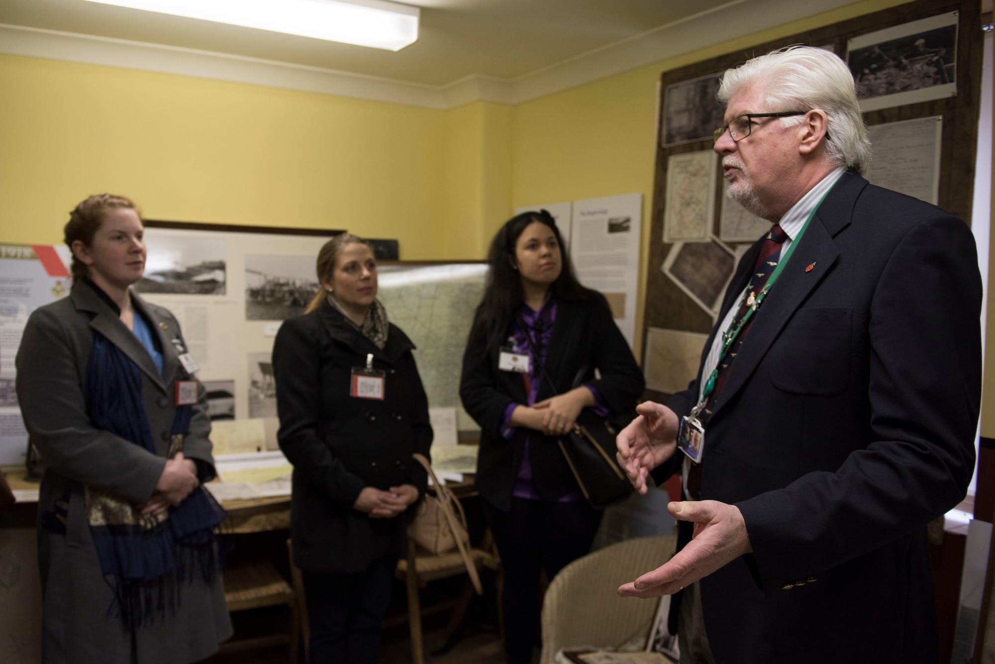 Jim Blackwood, events coordinator, leads a history tour at The Pathfinder Collection at the Wyton Heritage and Conference Centre, RAF Wyton, England, Feb. 21, 2020. The 501st Combat Support Wing 2019 Annual Award nominees and guests attended the museum to learn more about Pathfinder heritage in honor of the Year of the Pathfinder 2020 initiative. (U.S. Air Force photo by Airman 1st Class Jennifer Zima)