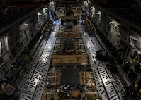 Staff Sgt. Johnathan Fishel, a C-17 Globemaster III loadmaster assigned to the 15th Airlift Squadron at Joint Base Charleston, S.C., and Technical Sgt. Casey Bradley, a loadmaster assigned to the Airborne and Special Operations Test Directorate at Pope Army Airfield, N.C., rig a humvee for an air drop at Pope Army Airfield, N.C., Feb. 19, 2020.