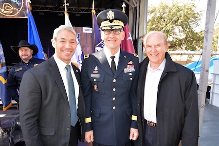 three men post for a photo