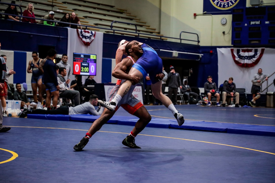 NAVAL BASE KITSAP, Wa. (Feb. 23, 2020) - Sgt. Isaac Dukes with the U.S. Army wrestling team competes against Sgt. Raymond Bunker with the U.S. Marine Corps wrestling team in the Freestyle event during the final round of the 2020 Armed Forces Sports Wrestling Championship at the Bremeton Fitness Complex. (U.S. Navy Photo by Mass Communication Specialist 1st Class Ian Carver/RELEASED).