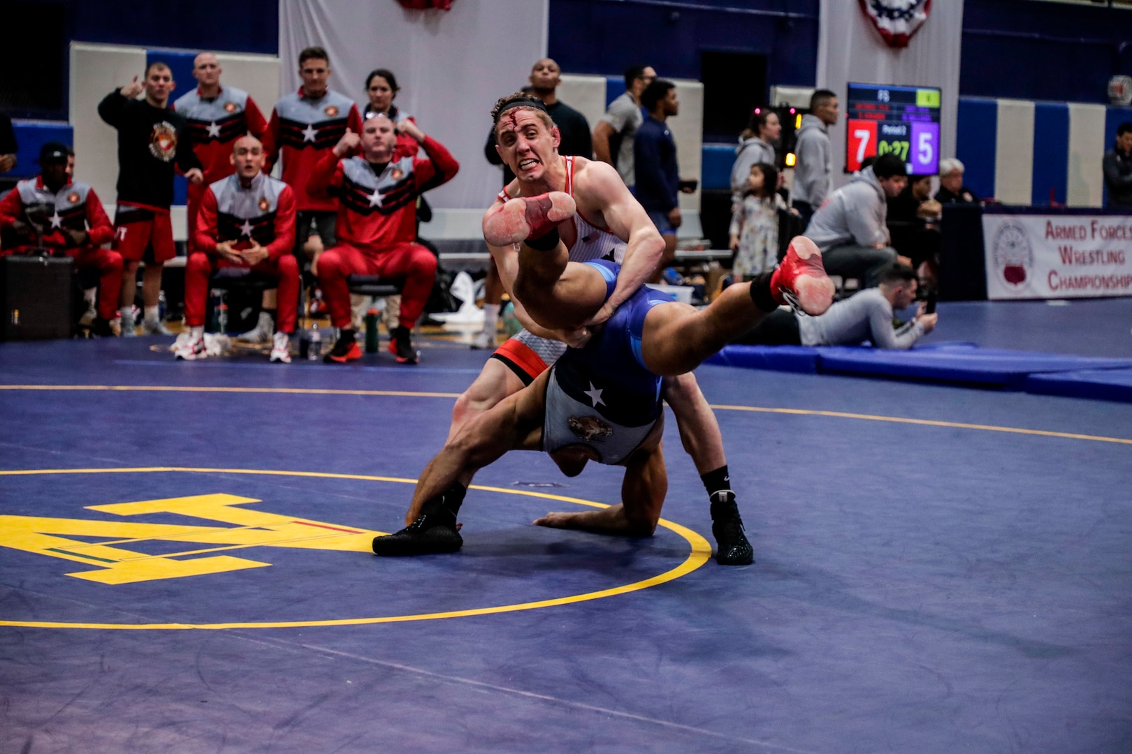 NAVAL BASE KITSAP, Wa. (Feb. 23, 2020) - 1LT Michael Hooker with the U.S. Army wrestling team competes against LCpl Ali Marciano with the U.S. Marine Corps wrestling team in the Freestyle event during the final round of the 2020 Armed Forces Sports Wrestling Championship at the Bremeton Fitness Complex. (U.S. Navy Photo by Mass Communication Specialist 1st Class Ian Carver/RELEASED).