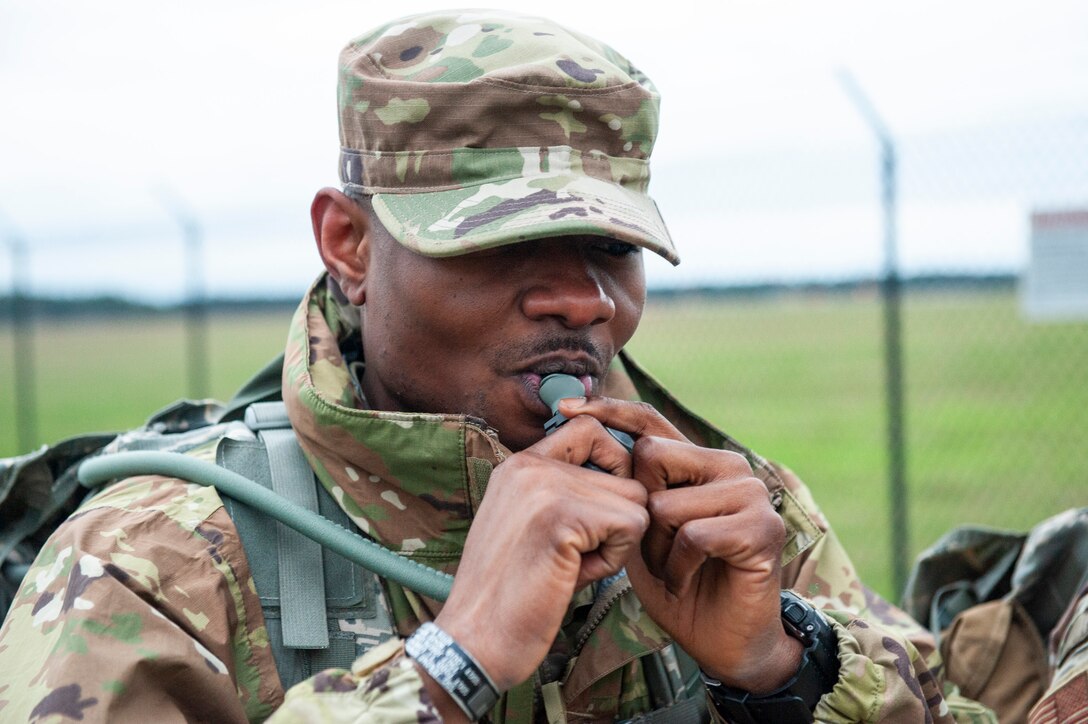 A photo of an Airman drinking water.