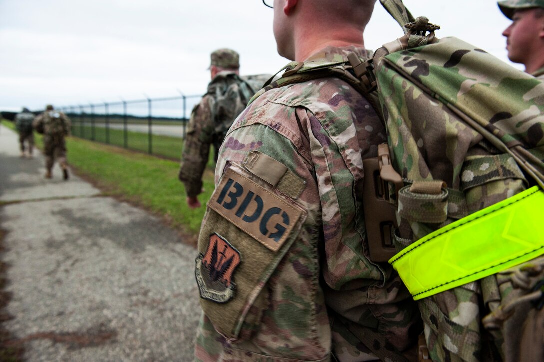 A picture of an Airman ruck marching