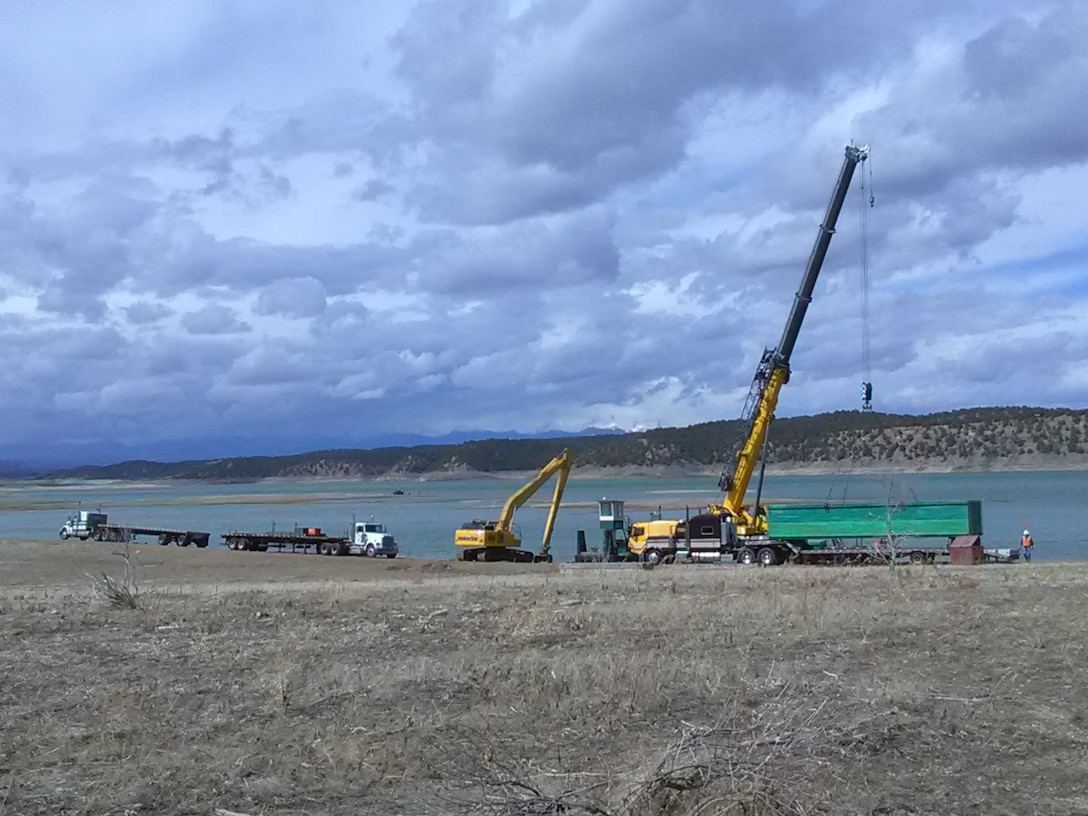Barges are unloaded during the rip rap project at Trinidad Dam, March 12, 2019.