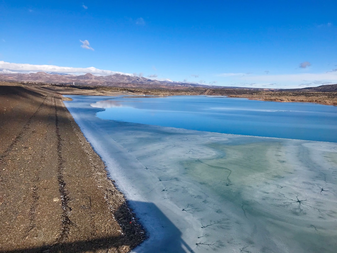 Looking west at a frozen Cochiti Lake with snow-capped mountains in the distance, Jan. 22, 2020.