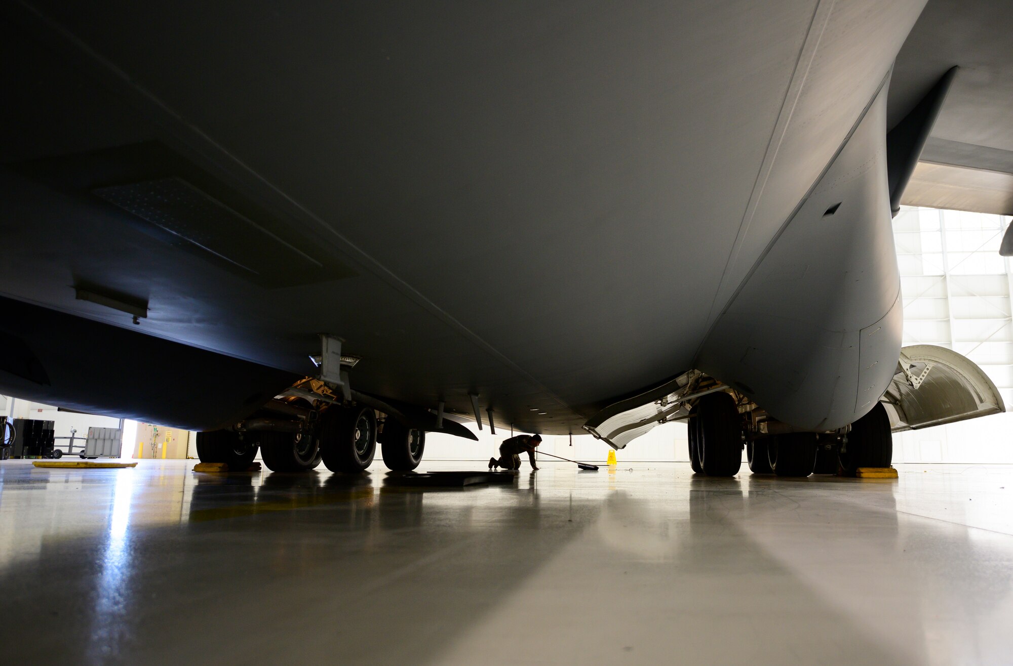 Photos of Airmen working on a C-17. Each month 860th Aircraft Maintenance Squadron Airmen refurbish a C-17 with help from the 60th MXS, which saves the Air Force money and keeps the gray tails mission ready.