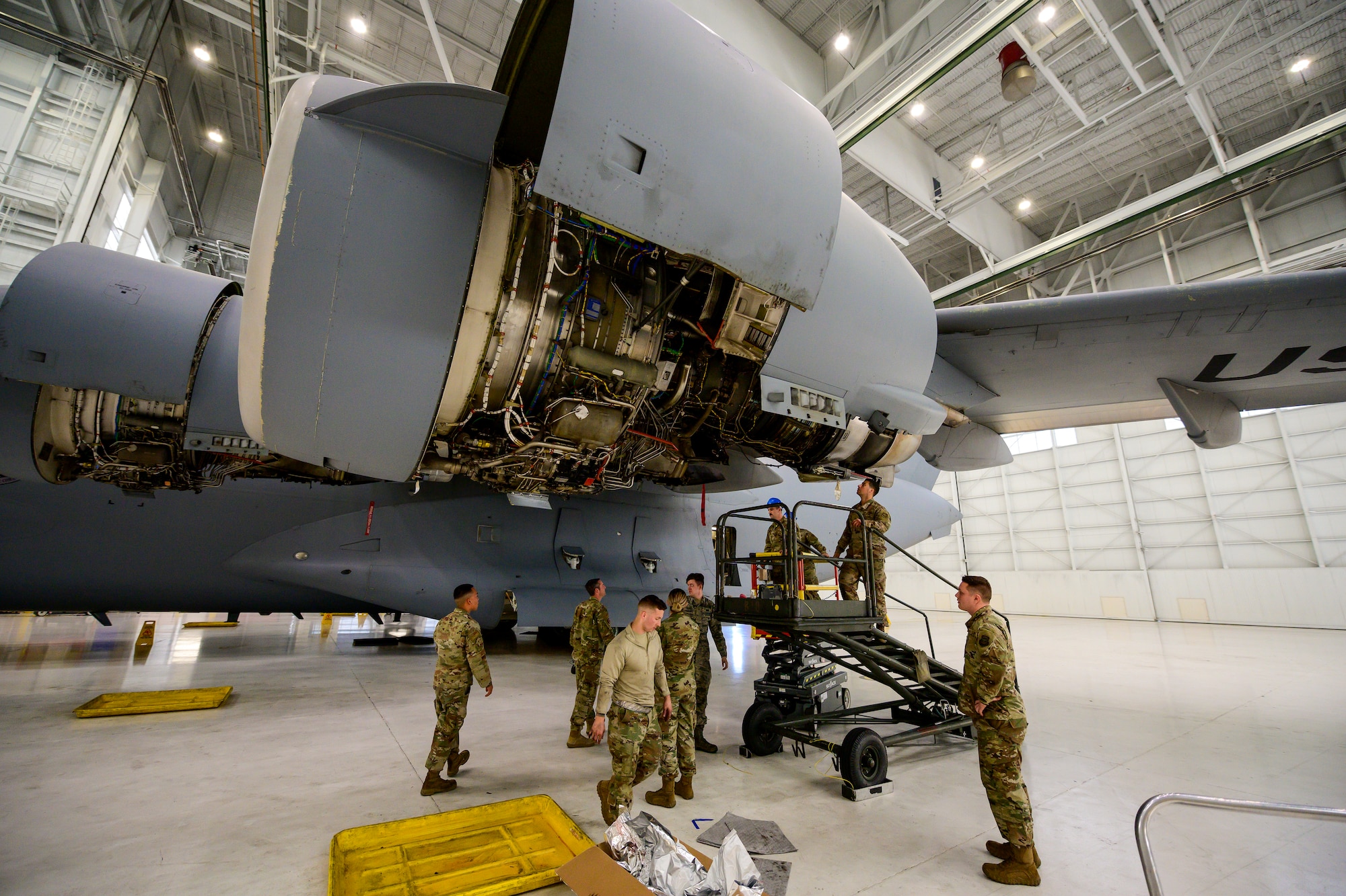Photos of Airmen working on a C-17. Each month 860th Aircraft Maintenance Squadron Airmen refurbish a C-17 with help from the 60th MXS, which saves the Air Force money and keeps the gray tails mission ready.