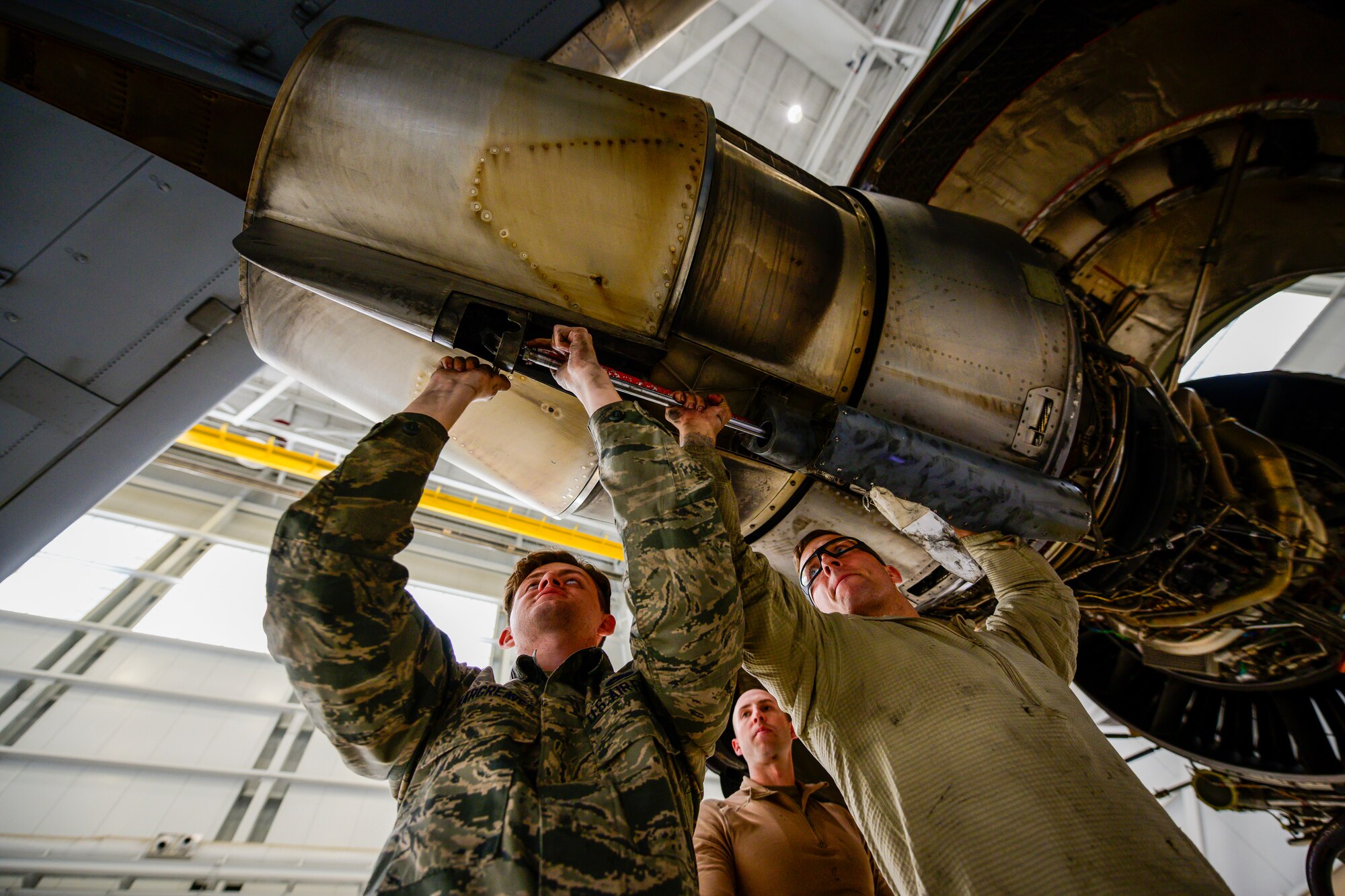 Photos of Airmen working on a C-17. Each month 860th Aircraft Maintenance Squadron Airmen refurbish a C-17 with help from the 60th MXS, which saves the Air Force money and keeps the gray tails mission ready.