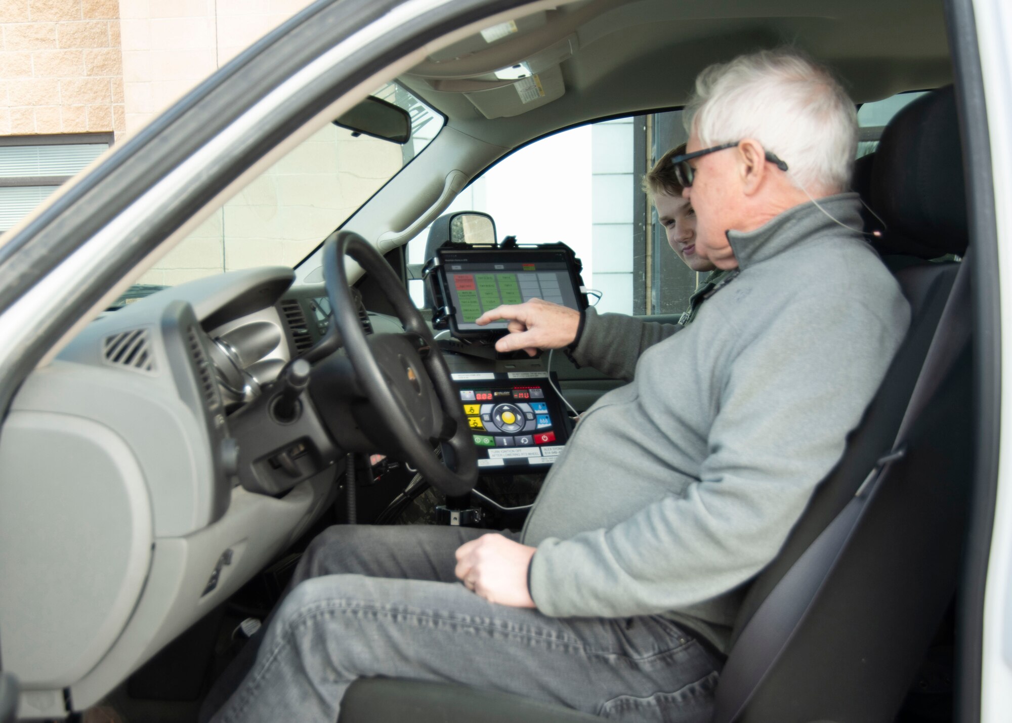 Don Halliday, Halliday Technologies owner, teaches the Airmen of the 366th Operations Support Squadron how to operate the Real Time Traction Tool from an android tablet Feb. 14, 2020, at the flight line on the Mountain Home Air Force Base, Idaho. The RT3 transfers the new data of a runway friction test to a website where Airfield Management and the Air Traffic Control tower can access and inform the pilot about the landing conditions of the runway. (U.S. Air Force photo by Airman 1st Class Akeem K. Campbell)