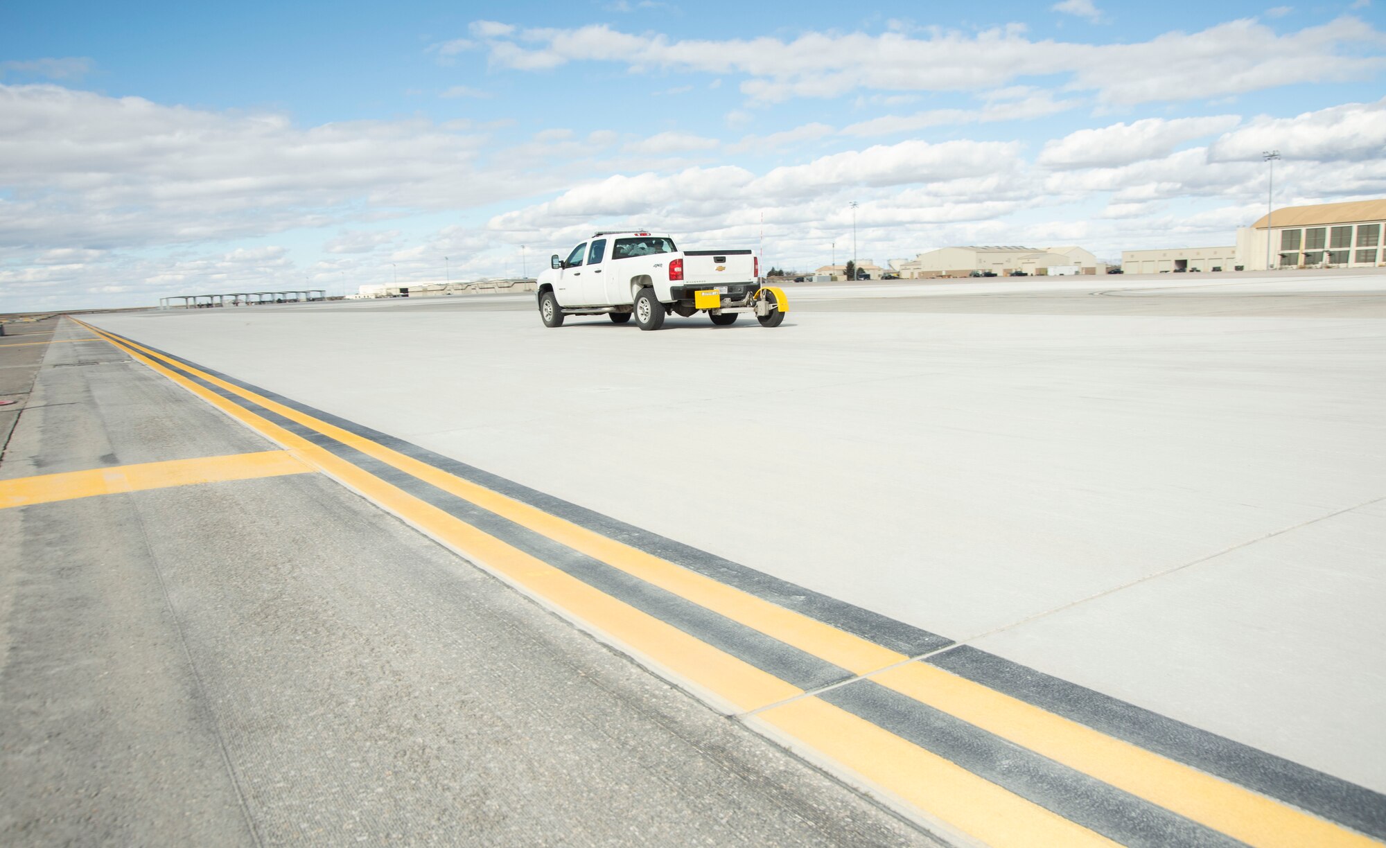 The Airmen of the 366th Operations Support Squadron along with Don Halliday, Halliday Technologies owner, test out the Real Time Traction Tool on the flight line Feb. 14, 2020, at Mountain Home Air Force Base, Idaho. On harsh weather days, the 366th OSS conducts runway friction tests with the RT3 to enhance readiness and further increase safer jet landings. (U.S. Air Force photo by Airman 1st Class Akeem K. Campbell)