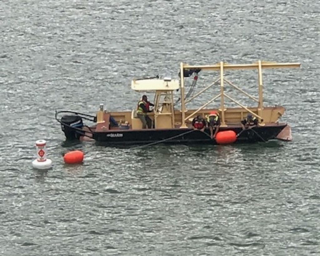 The Conchas maintenance crew sets the new buoy line across the front of Conchas Dam, Sept. 20, 2019. Photo by Nadine Carter, park ranger at Conchas Lake.