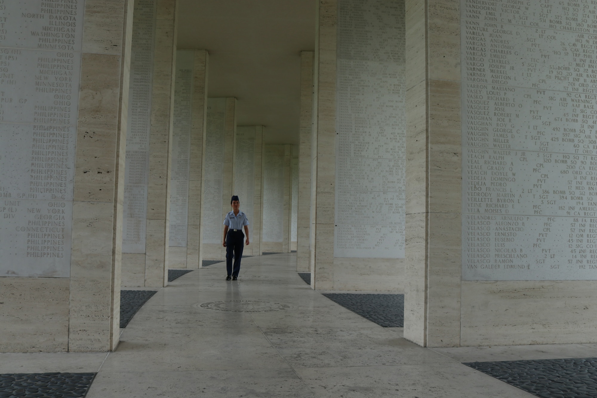 Airman 1st Class Ana Olarke, 317th Operations Support Squadron aircrew flight equipment journeyman, walks between the Walls of Missing at the Manila American Cemetery in Manila, Philippines, Feb. 17, 2020.