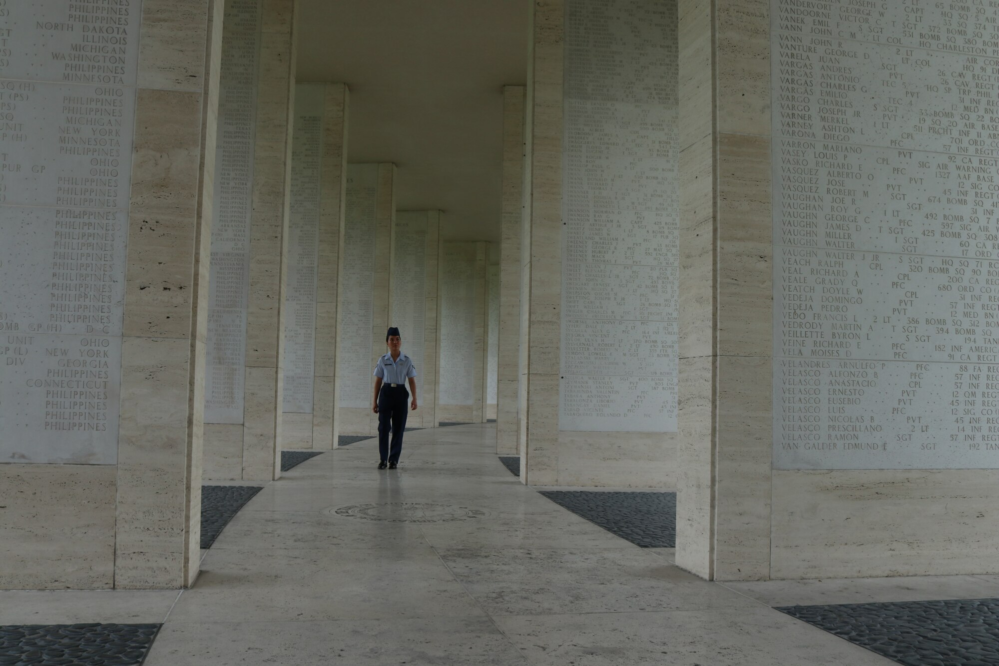 Airman 1st Class Ana Olarke, 317th Operations Support Squadron aircrew flight equipment journeyman, walks between the Walls of Missing at the Manila American Cemetery in Manila, Philippines, Feb. 17, 2020.