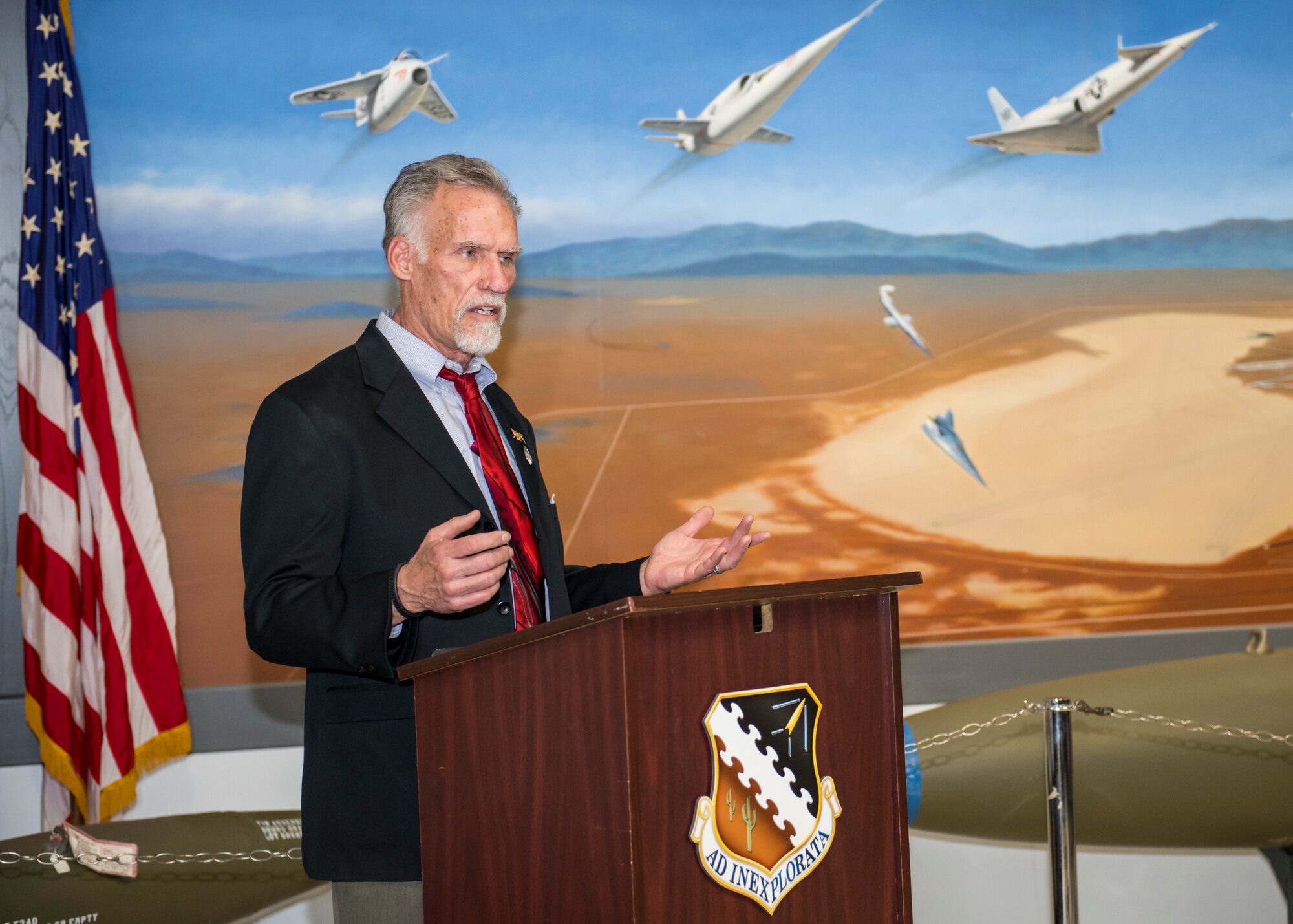 Art Thompson, Flight Test Museum Foundation Chairman, speaks at a special ceremony honoring Dr. Eileen Bjorkman, Air Force Test Center Executive Director, at Edwards Air Force Base, California, Feb. 25. Bjorkman recently donated $50,000 to Flight Test Museum Foundation to sponsor the RF-4C (#004) and help directly fund construction of the new Flight Test Museum being built outside the West Gate at Edwards Air Force Base. (Air Force photo by Giancarlo Casem)