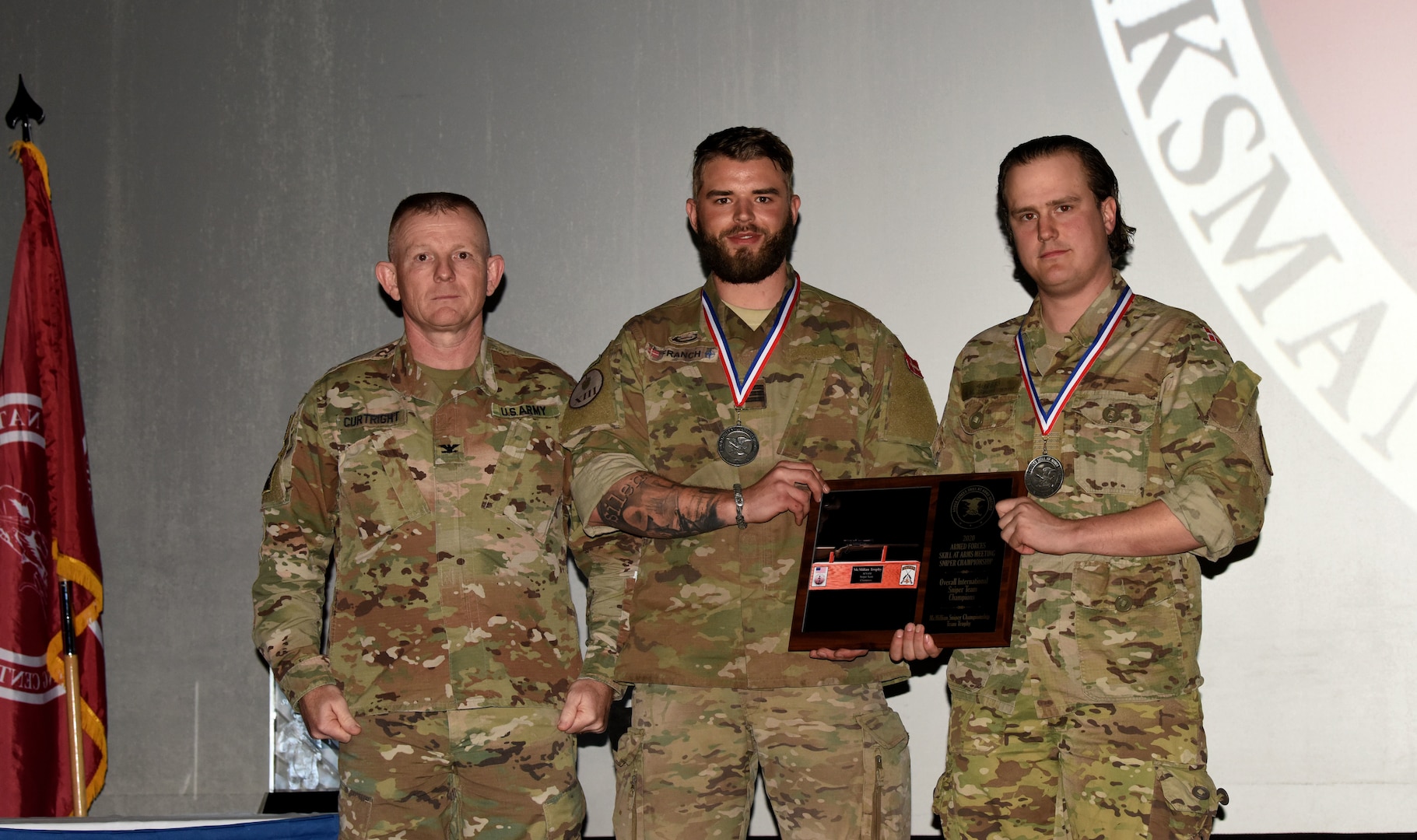 Lance corporals Steven Baunsgaard and Christoffer Franch, a sniper team from Denmark, received the international overall sniper team title and were presented a team plaque and individual medallions by Col. Marty Curtright, National Guard Marksmanship Training Center commander, at Fort Chaffee Joint Maneuver Training Center in Barling, Arkansas, Feb. 20, 2020. A two-person team from the Kansas National Guard won the national competition.