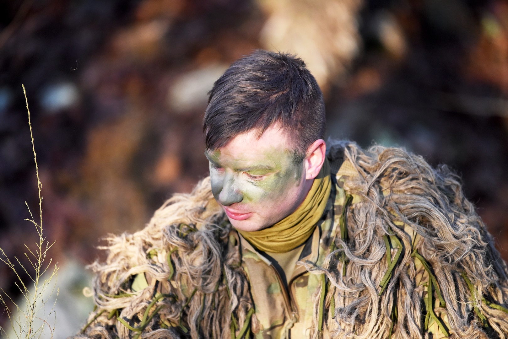 Staff Sgt. Ashton Sanford, Georgia National Guard, camouflages himself before the stalk event of the 49th Annual Winston P. Wilson Sniper Championship at Fort Chaffee Joint Maneuver Training Center in Barling, Arkansas, Feb. 19, 2020. The 54 snipers competed in three matches that day including stalk events, a pistol tournament, and an obstacle maneuver course.