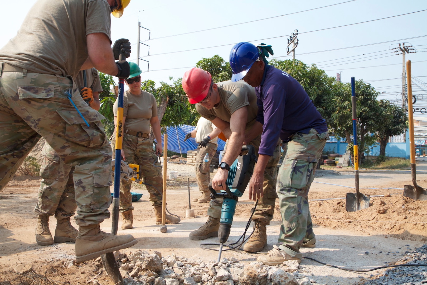 National Guard Soldiers from the 176th Engineering Co., Snohomish, Wash., break up concrete alongside Thai nationals as part of Exercise Cobra Gold in Phitsanulok, Thailand, Feb. 24, 2020. The exercise emphasizes coordination on civic action, developing interoperability and unity of action in crisis contingencies.