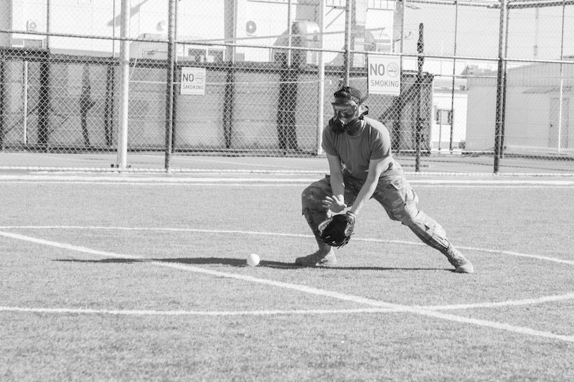 A U.S. Army Soldier, with 655 Regional Support Group, 316 Sustainment Command (Expeditionary), 377 Theater Sustainment Command, prepares to catch a ball during a game of gas mask baseball Feb. 12, 2020 at Joint Training Center-Jordan, paying tribute to former service members who used the sport to train for chemical warfare during WWI. We still have the greatest Army in the world. We serve the people of the United States and we are going to protect them with our lives if that is what it comes to. (U.S. Army photo by Sgt. 1st Class Shaiyla B. Hakeem)