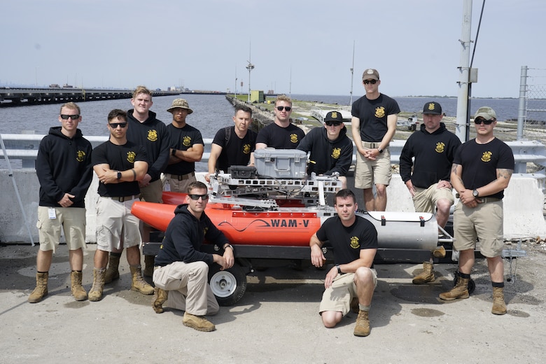 U.S. Army dive team members pause for a photo during training on the U.S. Army Engineer Research and Development Center's Coastal and Hydraulics Laboratory's Multifunctional Assessment Reconnaissance Vessel II