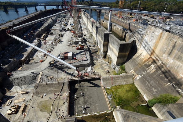 The U.S. Army Corps of Engineers Nashville District places concrete for the first monolith on the Chickamauga Lock Replacement Project Oct. 17, 2019 on the Tennessee River in Chattanooga, Tennessee. At the Chickamauga Lock Replacement Project, aa Tennessee Valley Authority project, the Nashville District is currently executing the lock chamber contract for the new 110-foot by 600-foot navigation lock, which includes 285,000 cubic yards of reinforced concrete. A conveyer system is placing concrete inside the coffer dam from the batch plant, a distance of about 900 feet in about a minute and a half. (USACE Photo by Lee Roberts)
