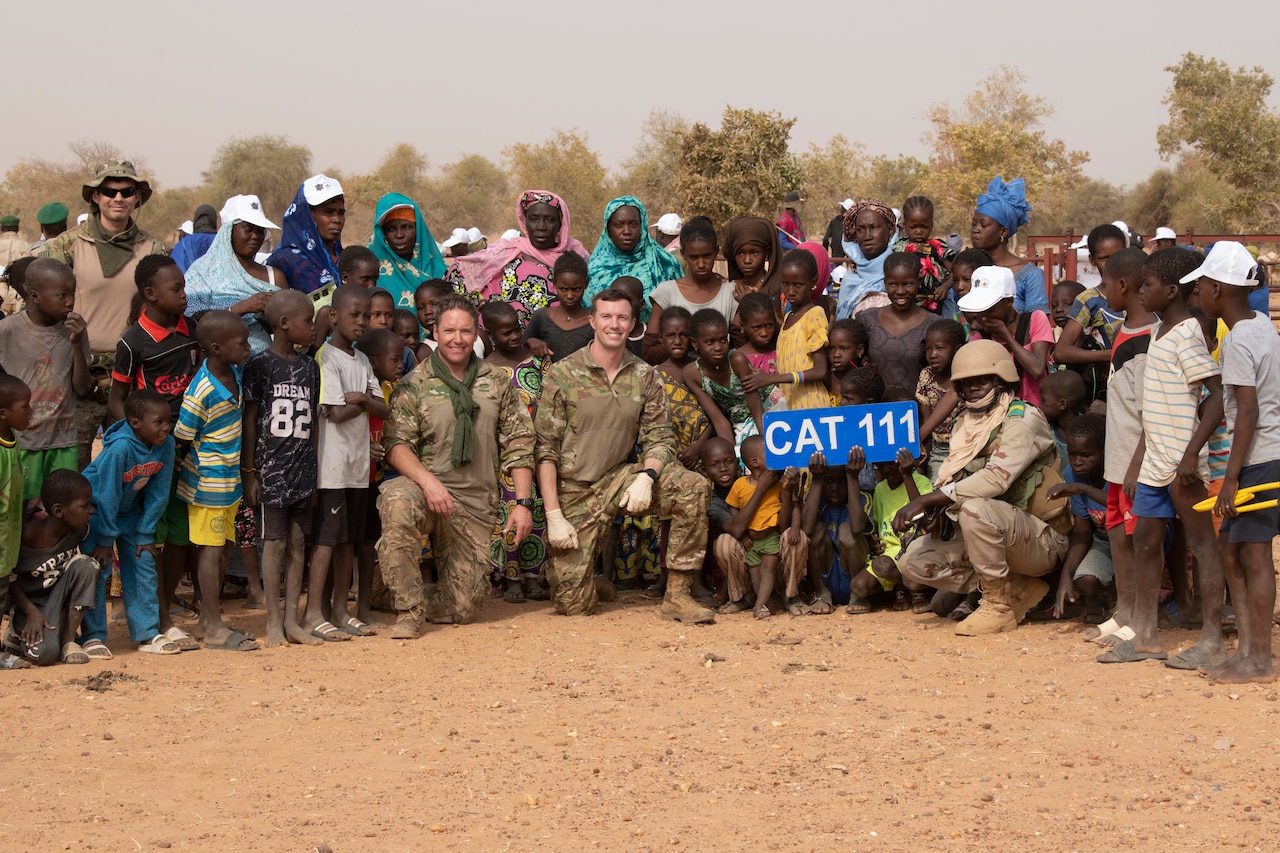 A large group of people pose for a photo.