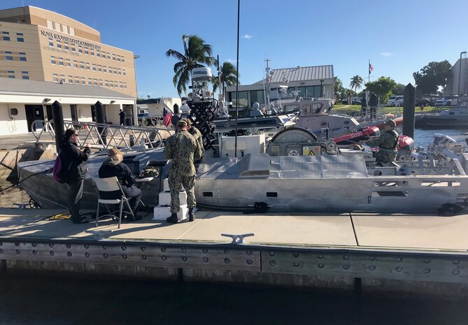 Sailors perform pre-mission checks on the Unmanned Influence Sweep System prior to an Operational Assessment mission off the coast of South Florida in November 2019. The UISS consists of an unmanned surface vehicle and a towed minesweeping payload for influence sweeping of magnetic, acoustic and magnetic/acoustic combination mine types while keeping warfighters out of the minefield