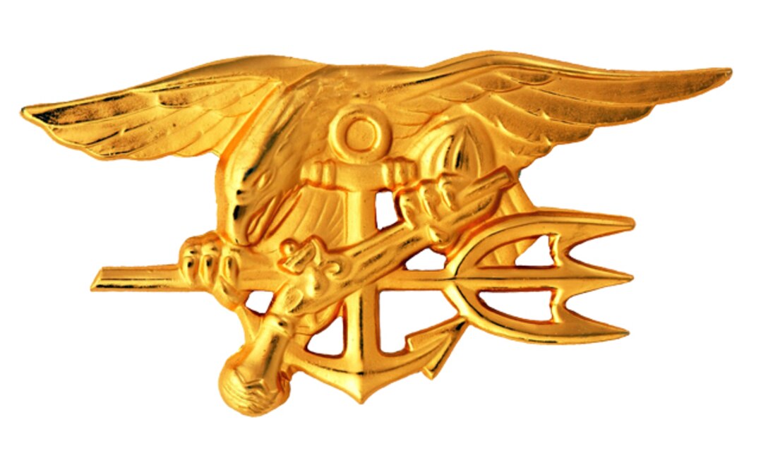 Gold insignia showing an eagle, anchor and trident