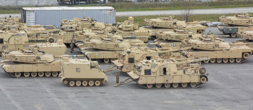 Soldiers guide tanks from the shipping vessel Green Lake at Joint Base Charleston’s Naval Weapon Station S.C., Feb 14, 2020. The tanks belong to the 3rd Armored Brigade Combat Team, Fort Carson Colorado. The 841st Transportation Battalion and the 3rd Armored Brigade Combat Team partnered to off load equipment from the shipping vessel Green Lake for a return to home station. The cargo was diverted to Joint Base Charleston and other ports on the East Coast because of congestion at the Port of Beaumont, Texas.