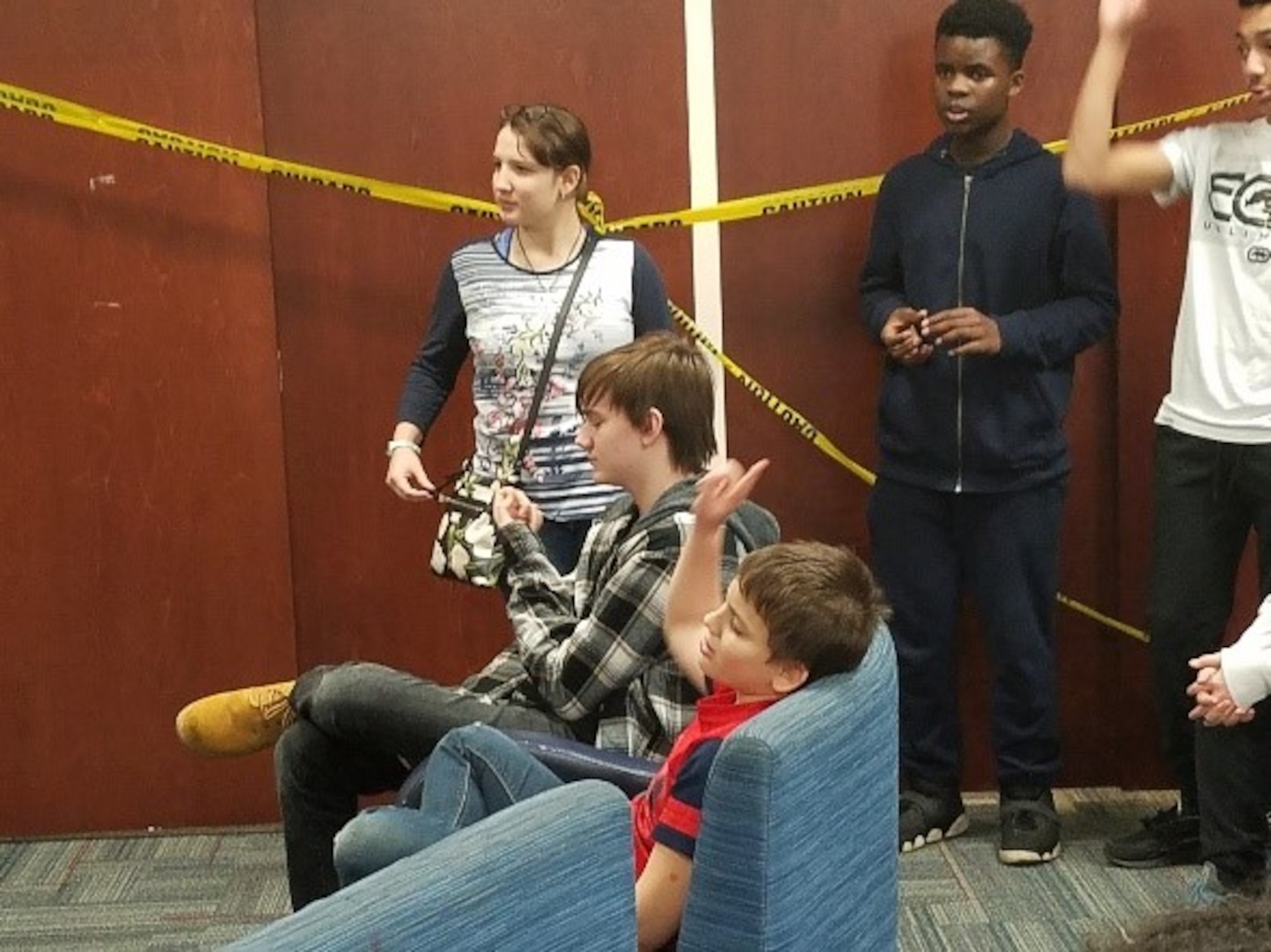 Youth Center kids participate in answering questions about Teen Dating Violence. (U.S. Air Force photo/Laura McGowan)