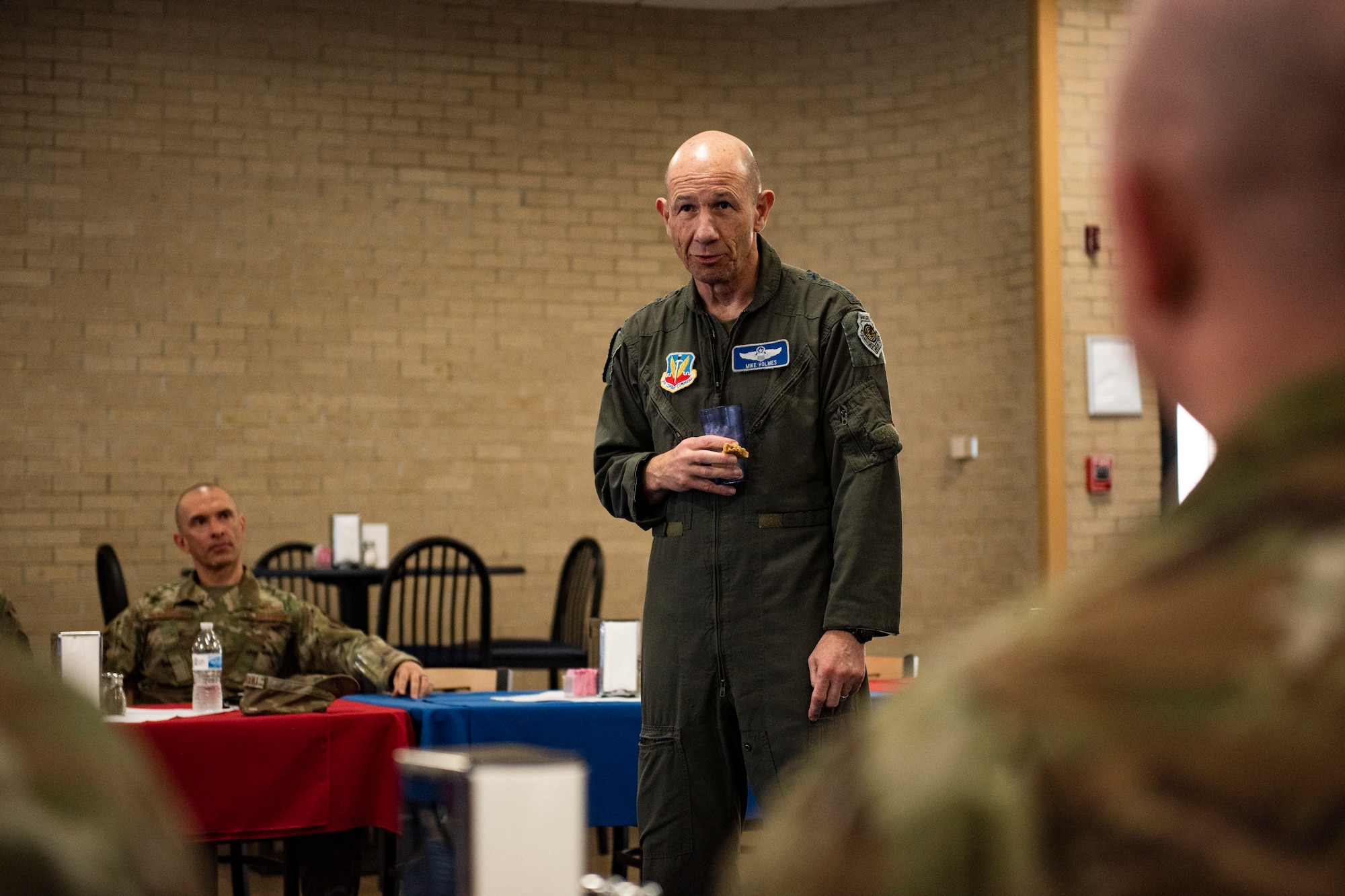 U.S. Air Force Gen. Mike Holmes, the commander of Air Combat Command, talks with 325th Fighter Wing leaders during a lunch break on his tour of Tyndall Air Force Base, Florida, Feb. 25, 2020. Holmes spoke with leadership about the future of ACC and how Tyndall fits into that vision. (U.S. Air Force photo by Staff Sgt. Magen M. Reeves)