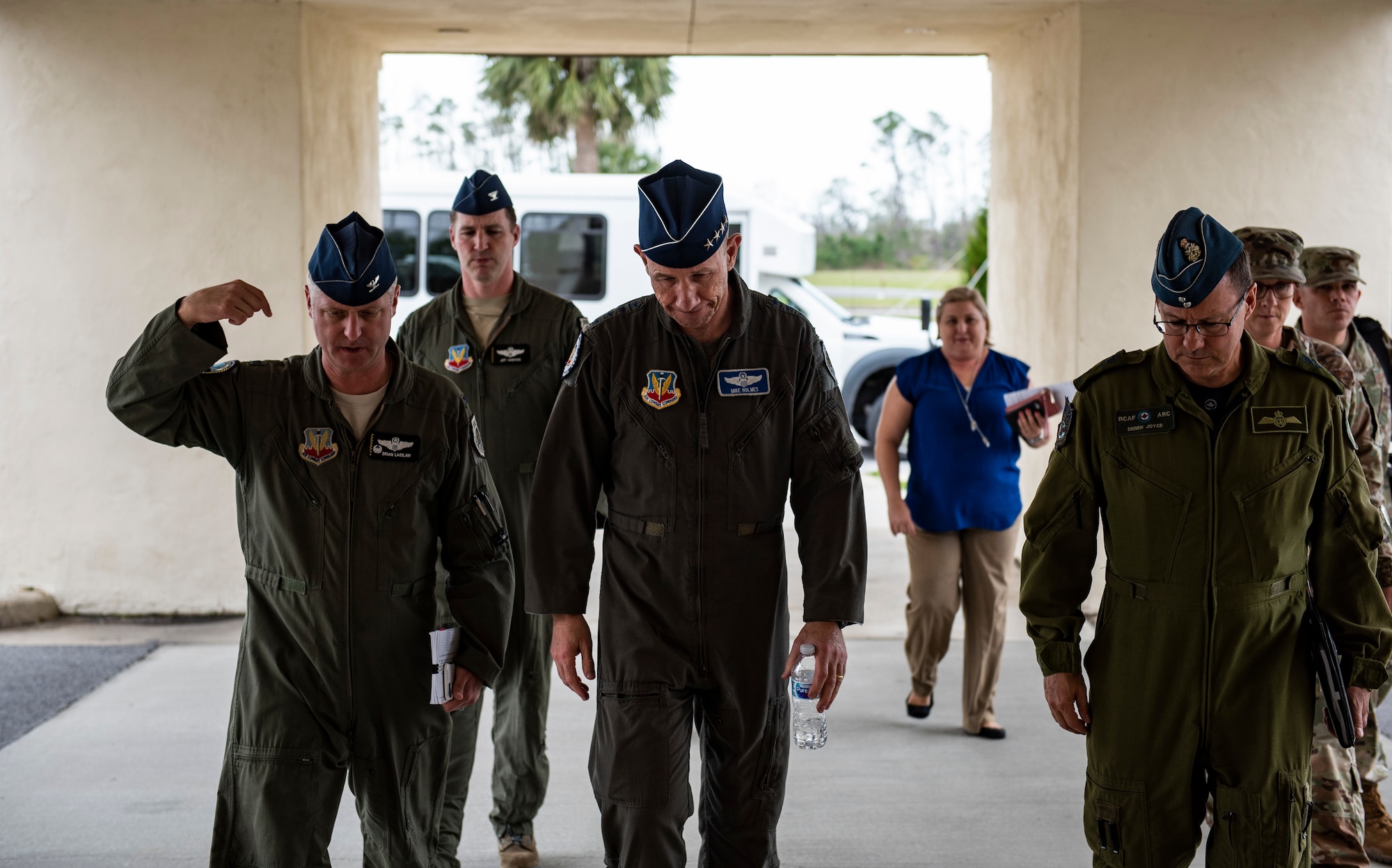 U.S. Air Force Col. Brian Laidlaw, 325th Fighter Wing commander (left), walks with U.S. Air Force Gen. Mike Holmes, the commander of Air Combat Command (center), and Royal Canadian Air Force Major-General Derek Joyce, Continental North American Aerospace Defense Command Region deputy commander (right), to a town hall at Tyndall Air Force Base, Florida, Feb. 25, 2020. Holmes outlined his vision for the future of Tyndall and how the base’s mission fits into ACC’s priorities. (U.S. Air Force photo by Staff Sgt. Magen M. Reeves)