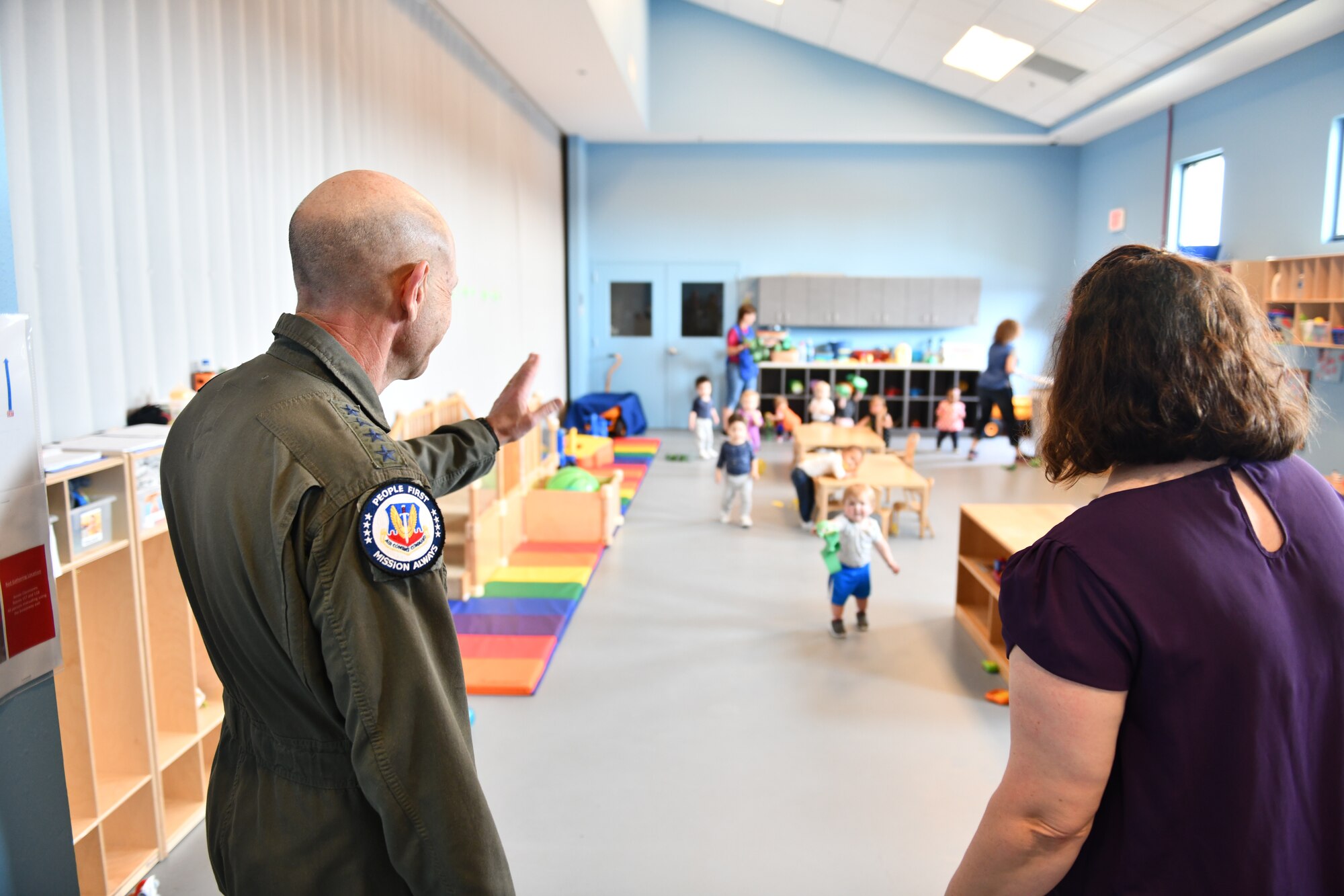 U.S. Air Force Gen. Mike Holmes, the commander of Air Combat Command, waves at children playing at the Child and Youth Program Center, Tyndall Air Force Base, Florida, Feb. 25, 2020. Holmes visited Tyndall to see how far it’s come with rebuilding after Hurricane Michael. (U.S. Air Force photo by Senior Airman Stefan Alvarez)