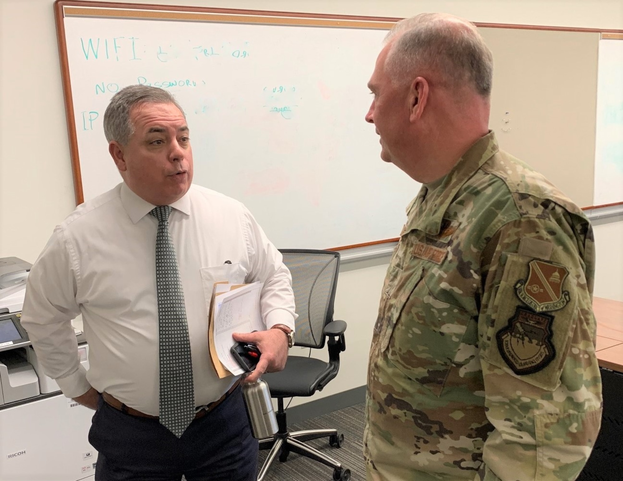 A staffer chats with Air Force District of Washington Commander Maj. Gen. Ricky N. Rupp during the general's visit to Marine Corps University at Quantico, Virginia, Feb. 20. Marine Corps University is the U.S. Marine Corps Professional Military Education proponent. Through its resident and non-resident programs, the MCU develops the professional competence of its Marines, other service, international, and civilian students.