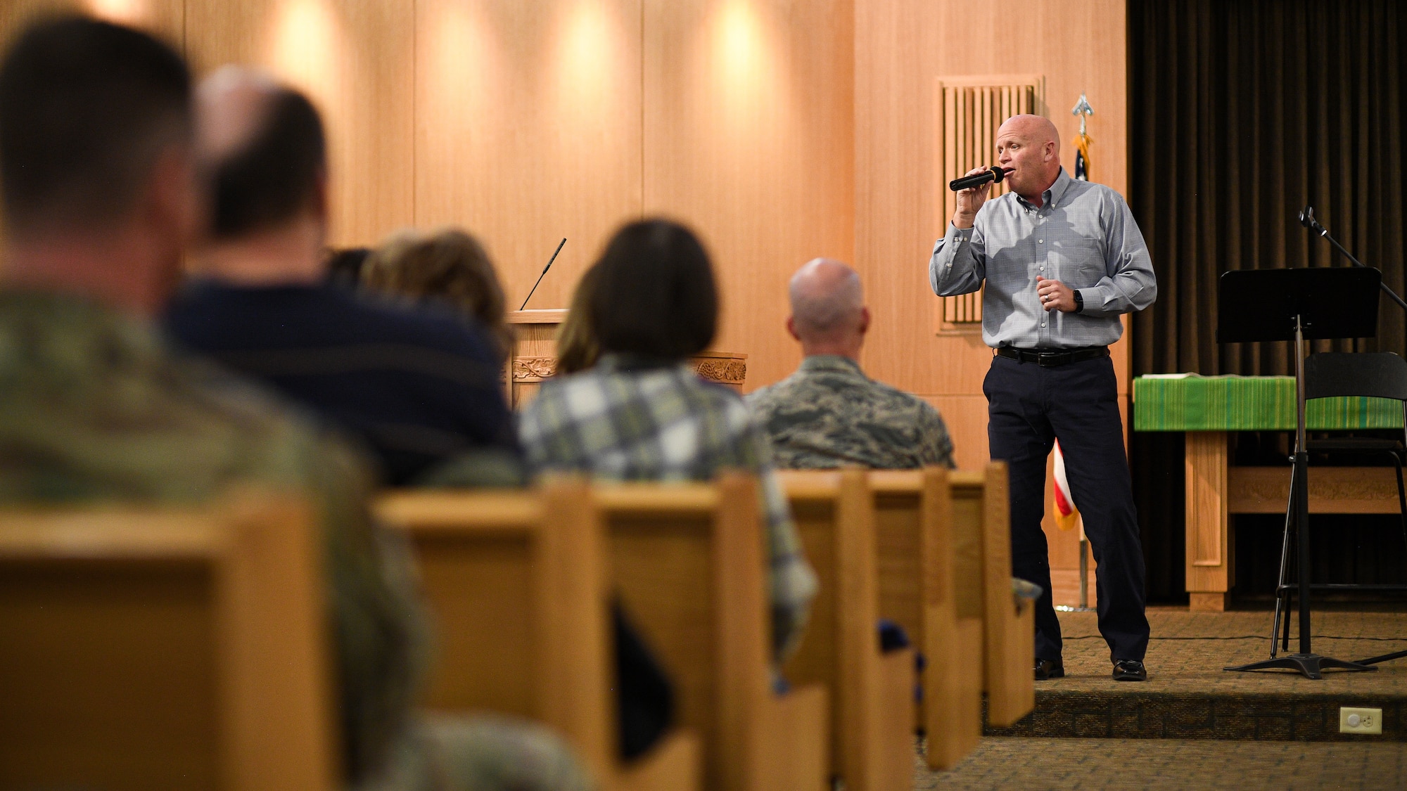 Joel McCausland sings in the base chapel during a National Prayer Luncheon at Hill Air Force Base, Utah, Feb. 25, 2020. McCausland, a member of the musical duo "After Glow", spoke and performed at this year's event. The theme of this year's interfaith luncheon was "You are not alone." (U.S. Air Force photo by R. Nial Bradshaw)